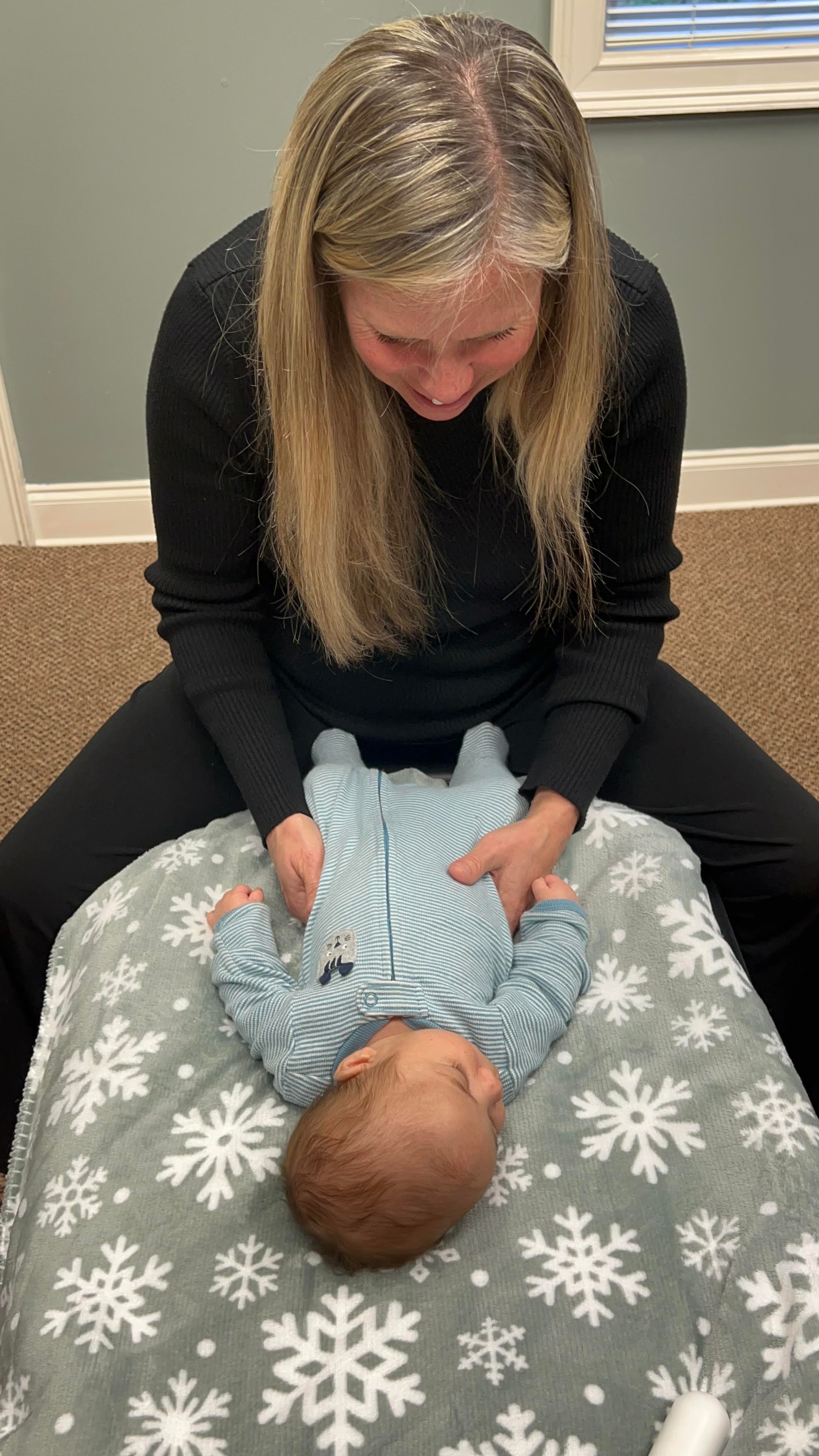 Dr Danielle Pichette examining baby for neurological stress