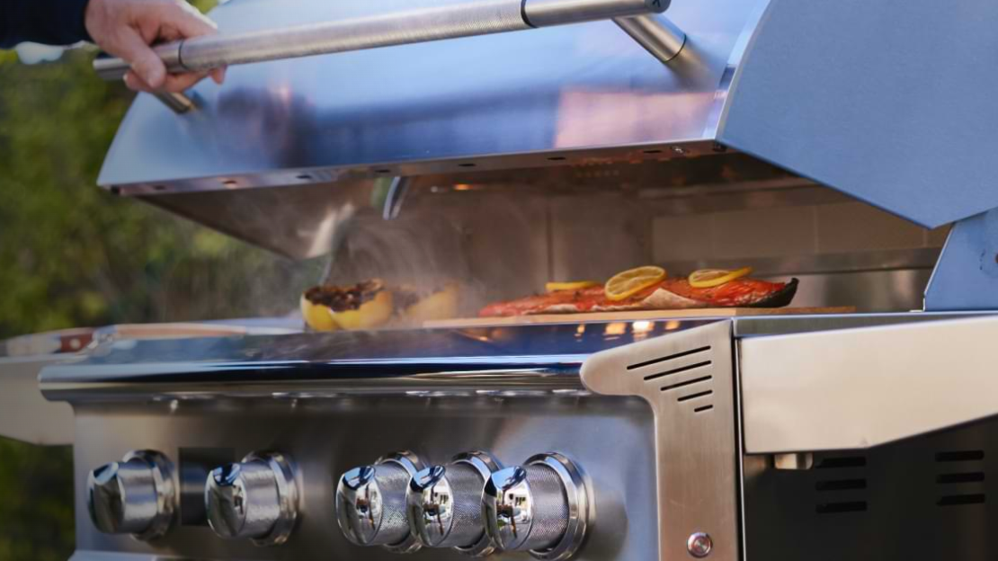 Blaze LTE+ gas grill with open lid on lawn.