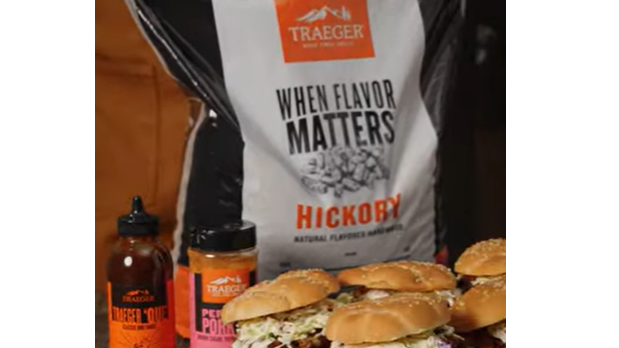 Traeger Recipe Pairings with pellets, sauces, and ribs on wooden table.