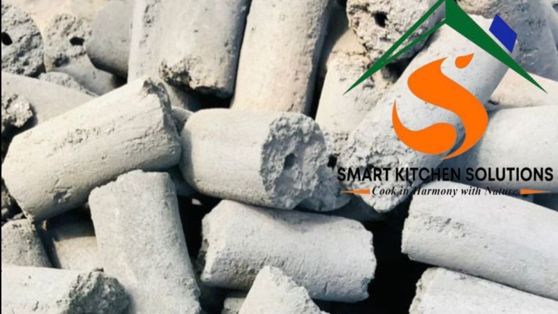 Hands shaping energy-saving eco briquettes from recycled organic farm waste.