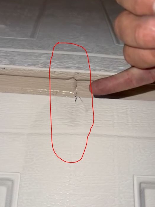 close up cracked rusted garage door panel garage door repair near me detailed metal
