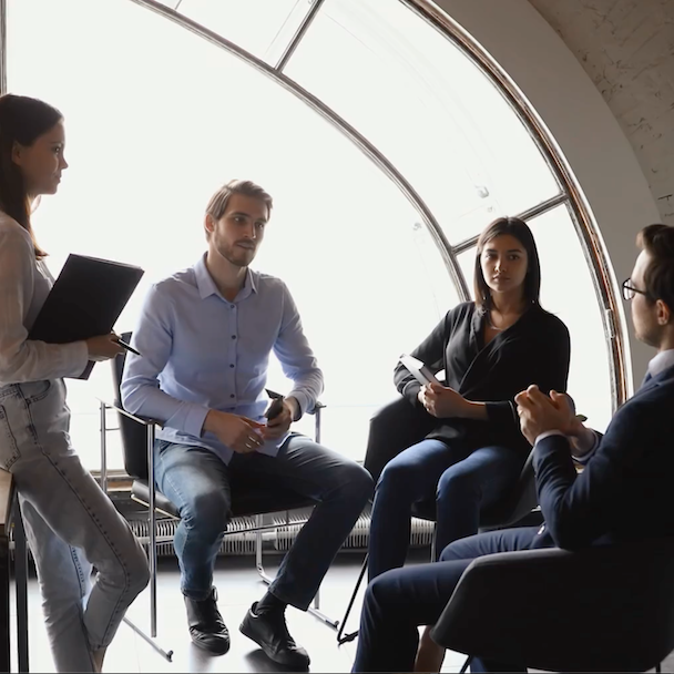 Video team planning their studio shoot.