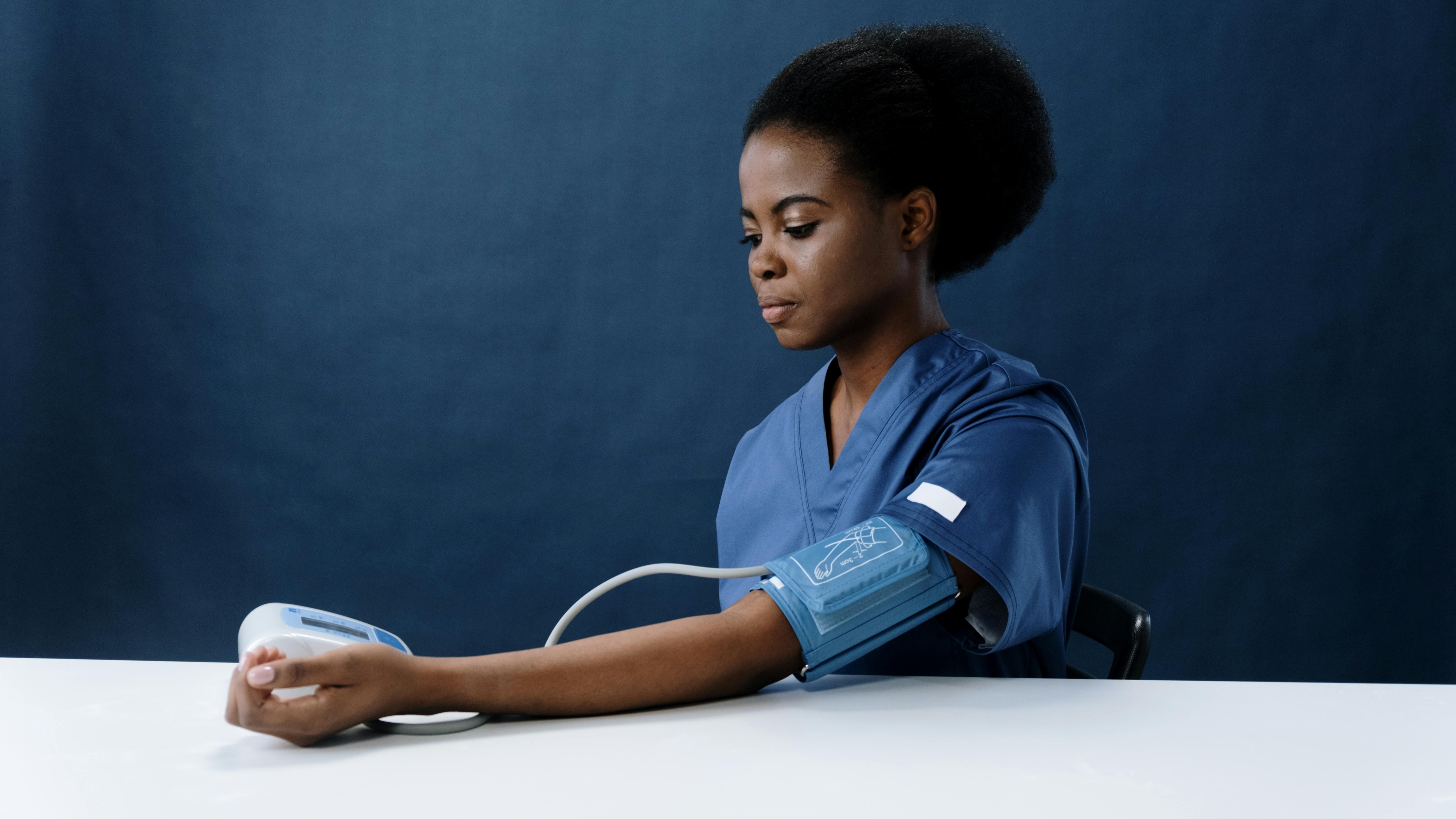 black woman doing a blood pressure check