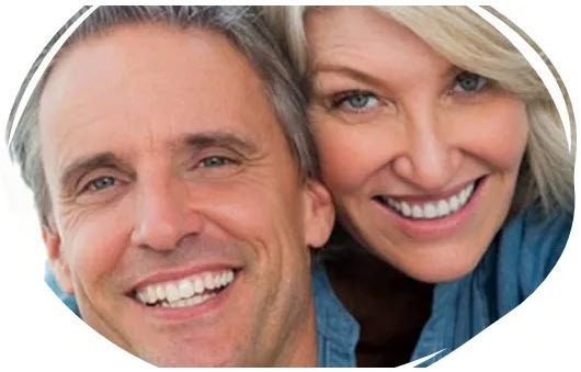 Dental patients happy with their new dental implants smiling