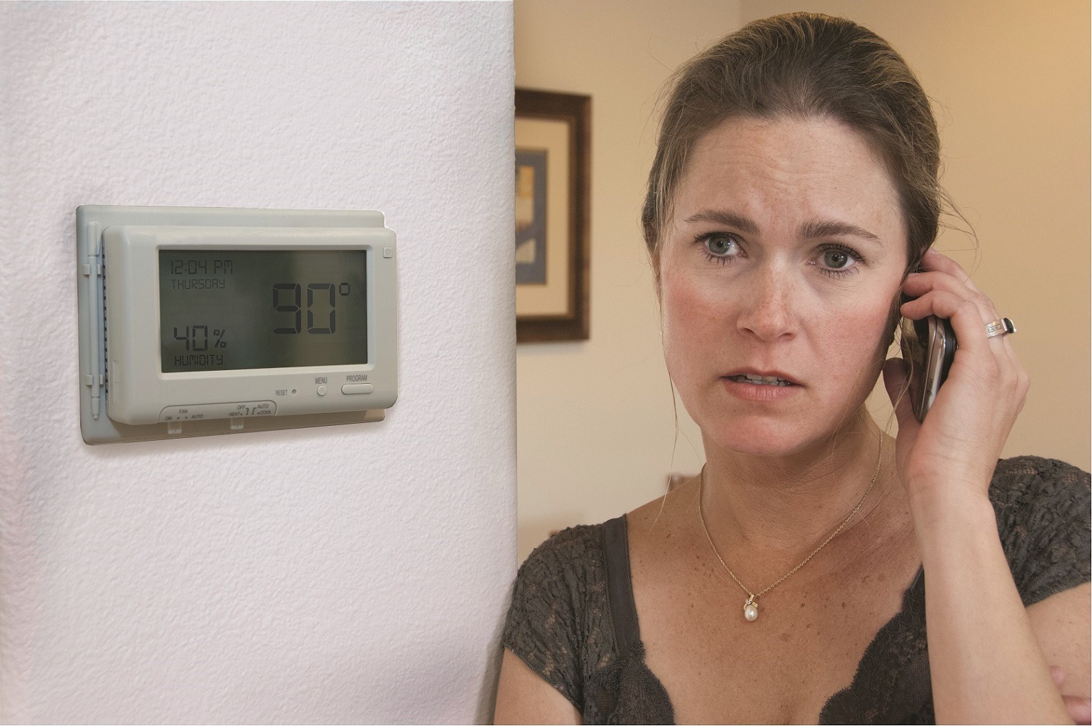 tired customer next to thermostat