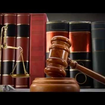 Gavel with books behind it