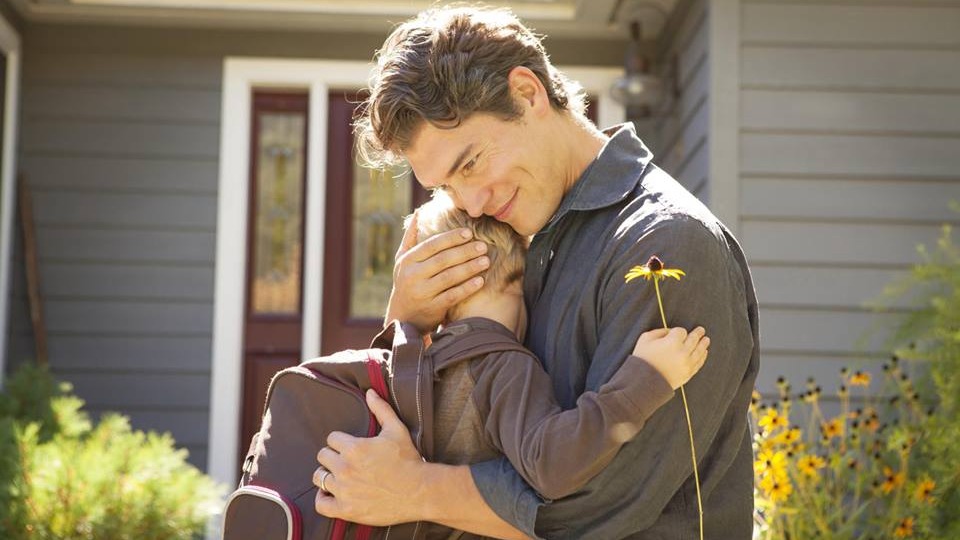 Father hugging his son