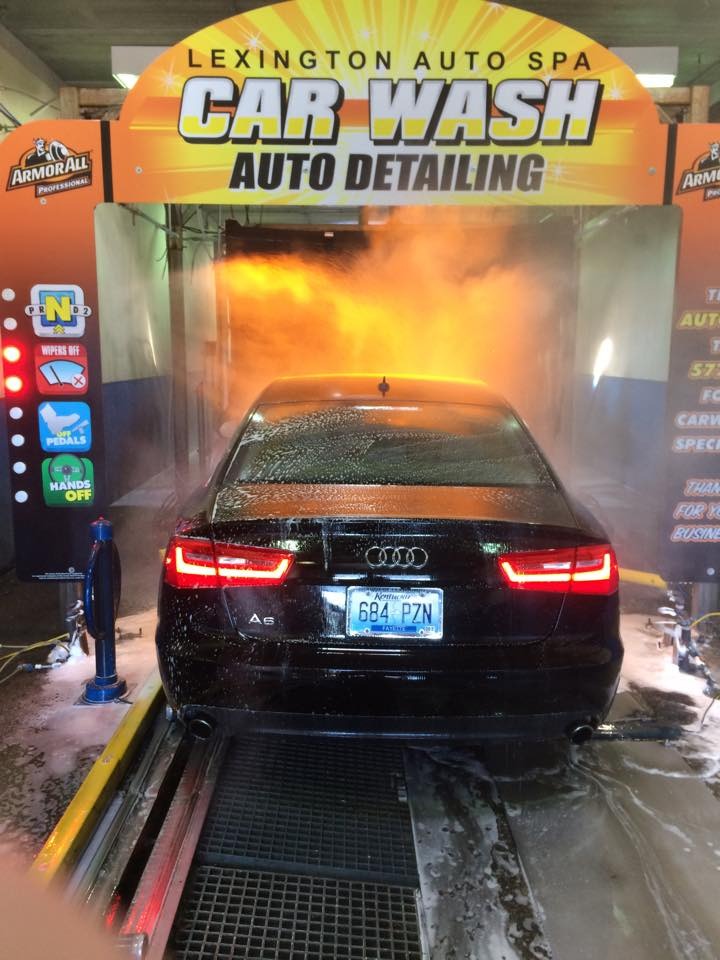 Car entering wash lane in lexington auto spa