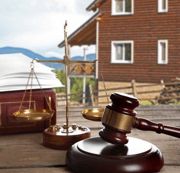 Gavel in front of property