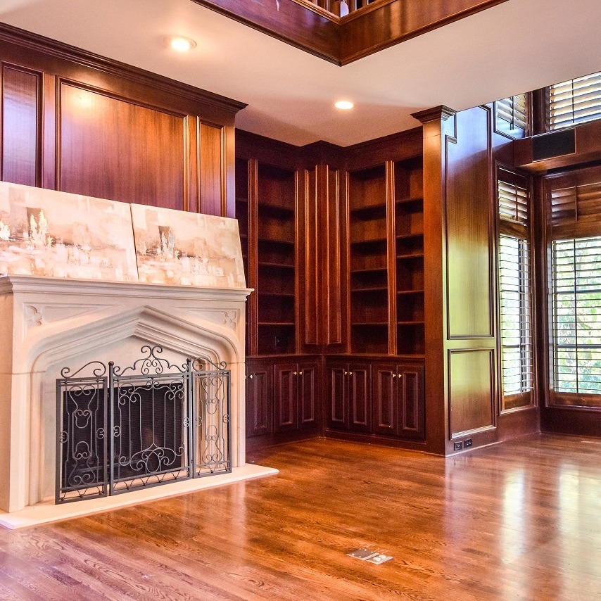 Wood colored den with fireplace