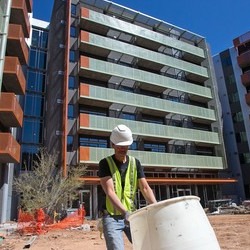 Workman cleaning worksite