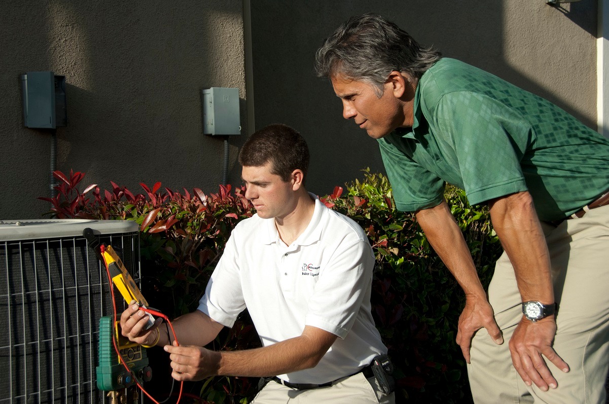 technician testing HVAC system