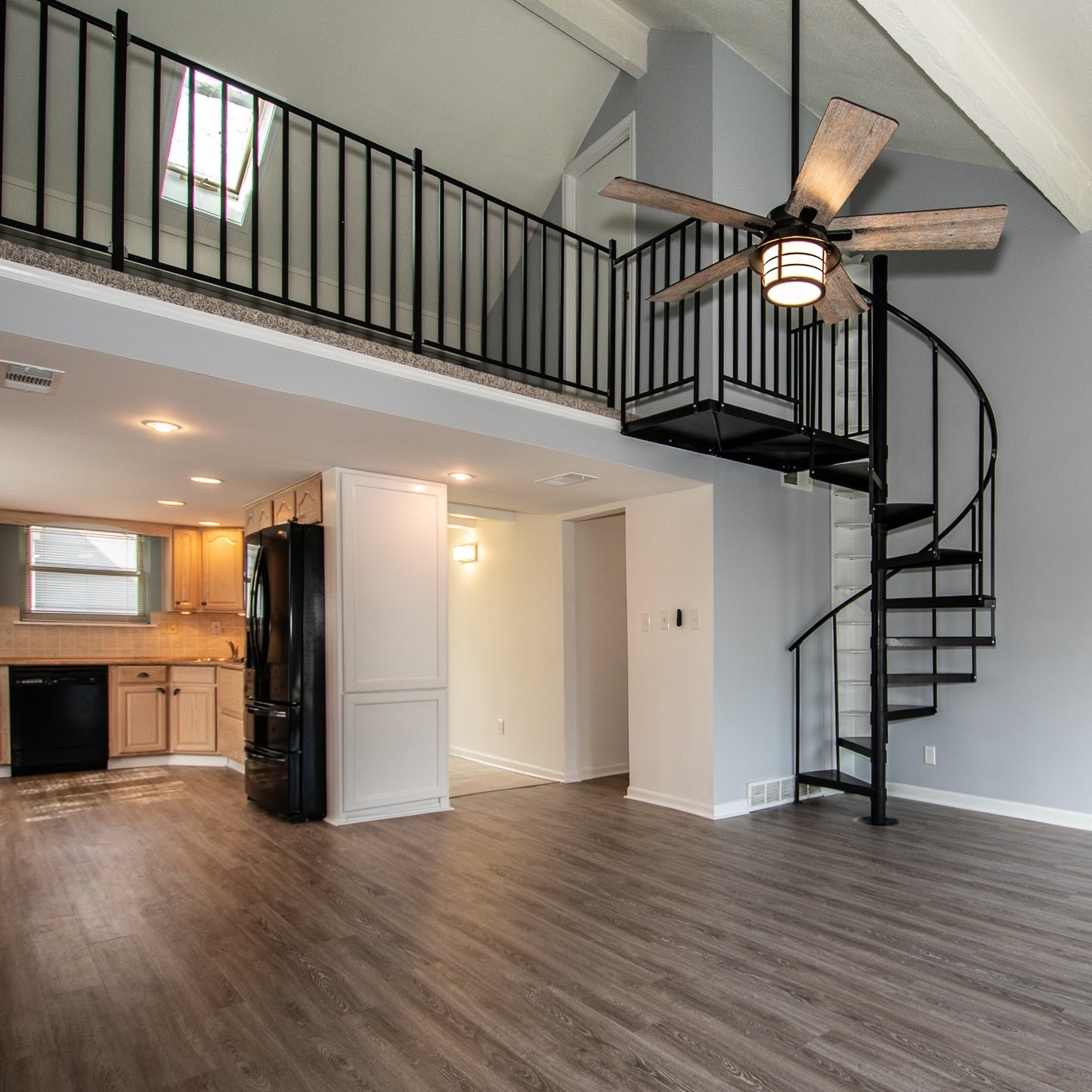 Tiled Living Room with Spiral Staircase