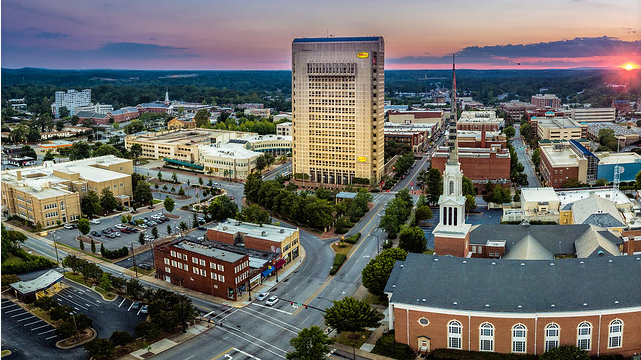 Group of professionals in formal attire symbolizing real estate in Spartanburg