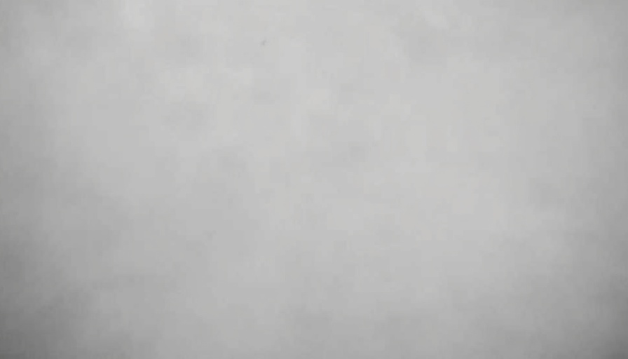 Blurry grayscale image with indistinct details.