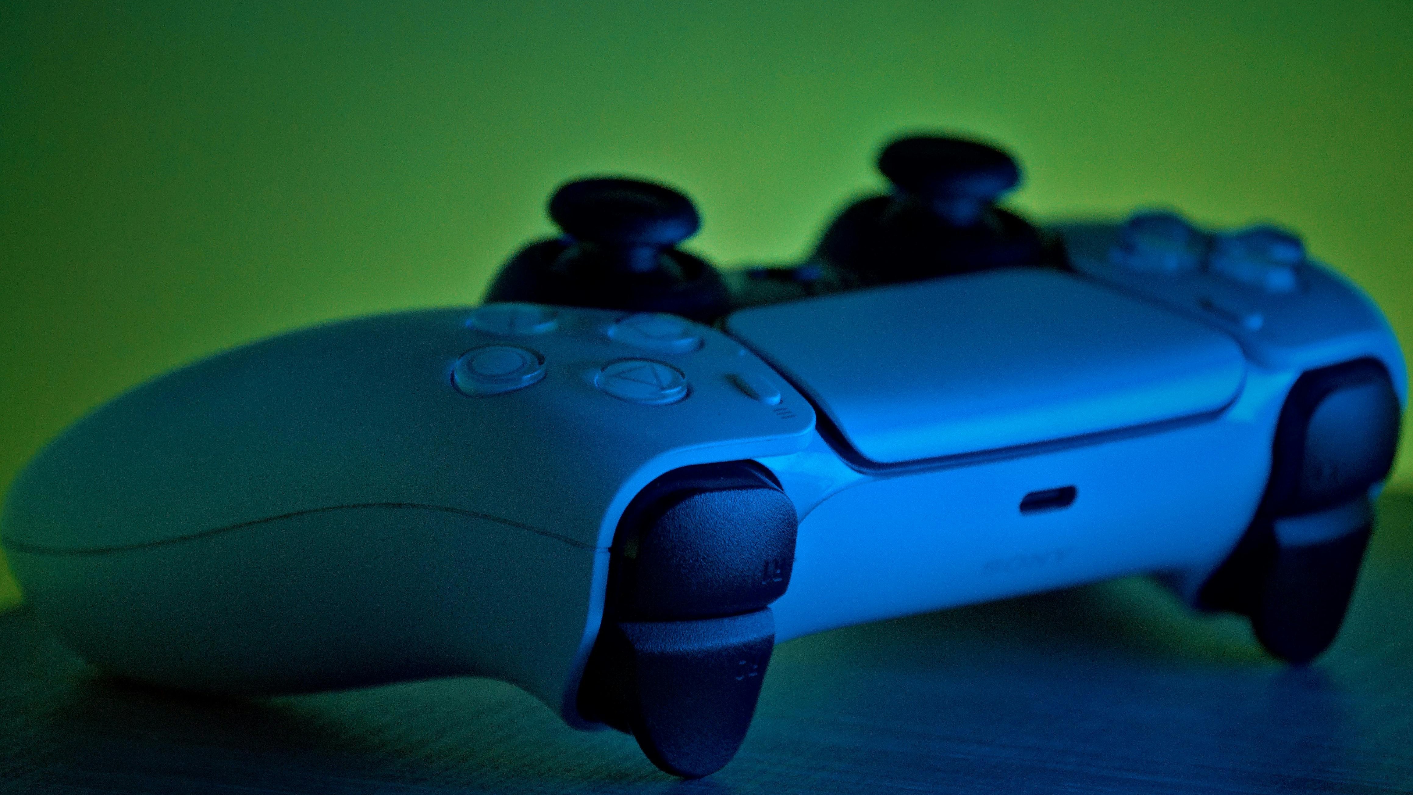 Gamer using PS5's new accessories in immersive VR space game.