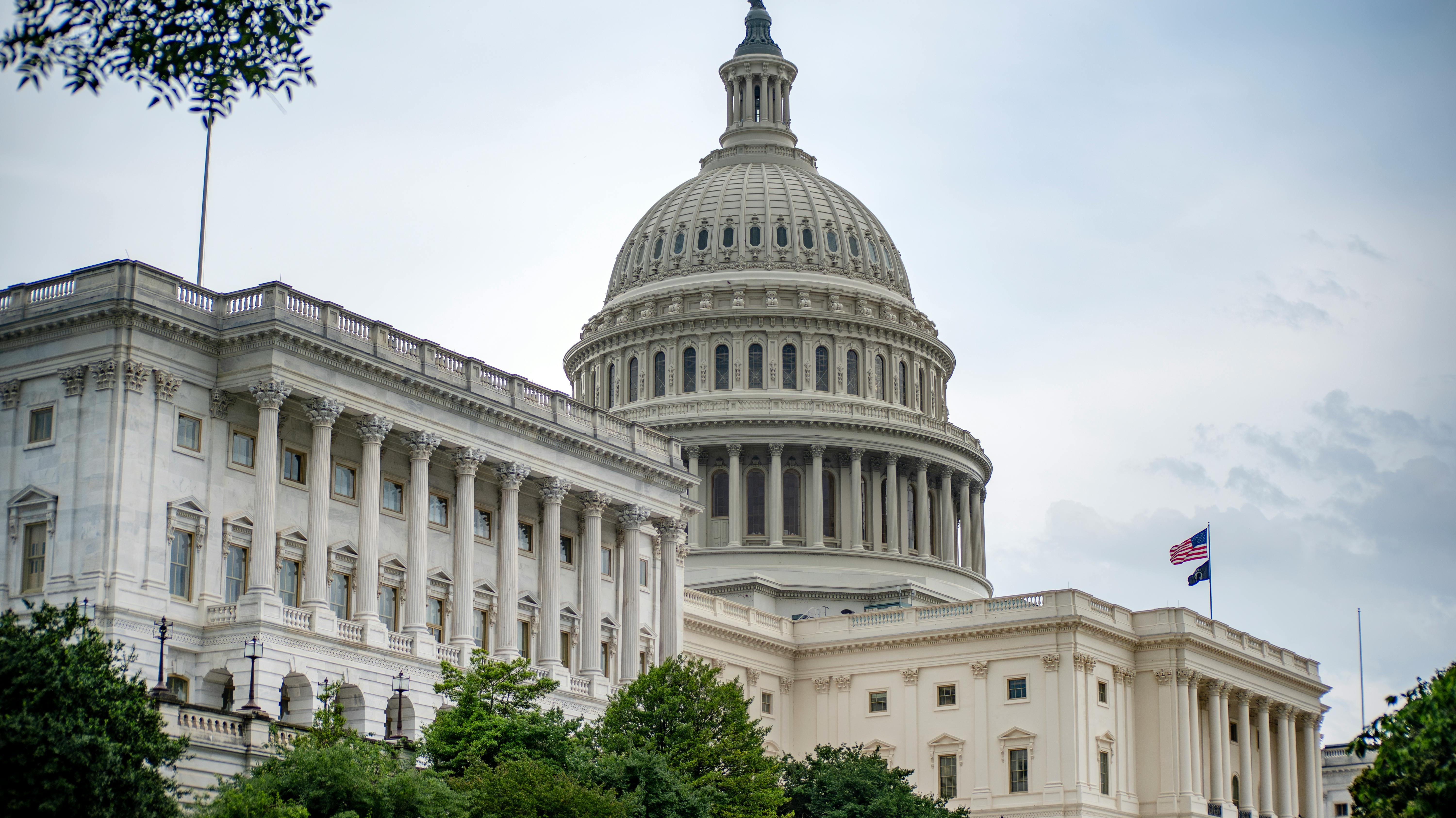 Federal agencies workforce cuts illustrated by a grand classical building