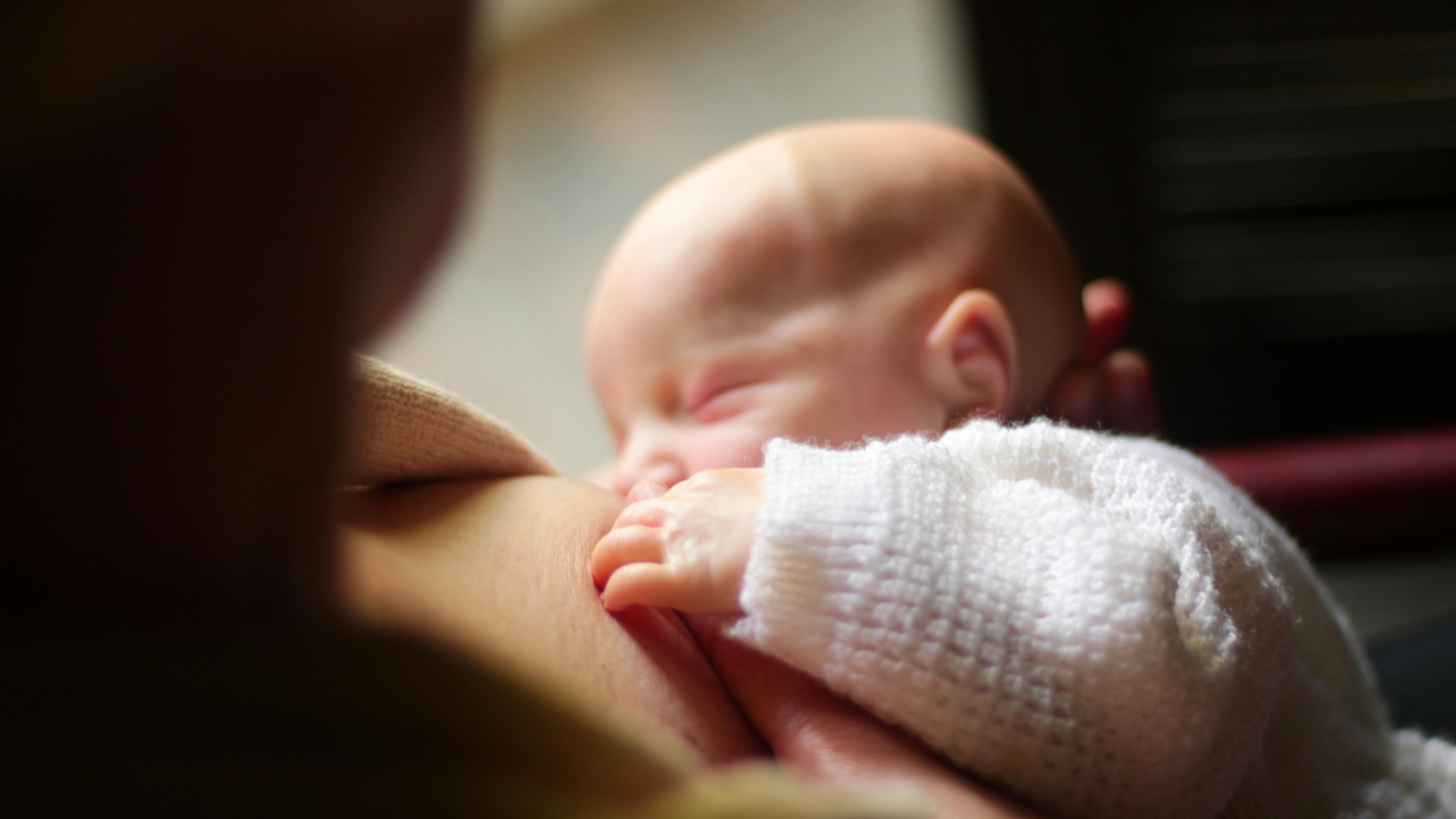 Manual breast pump in use indicating milk supply signs.