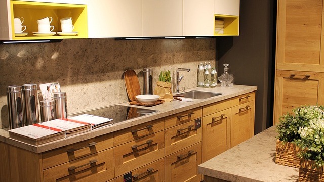 Budget kitchen renovation with family cooking in cozy space.