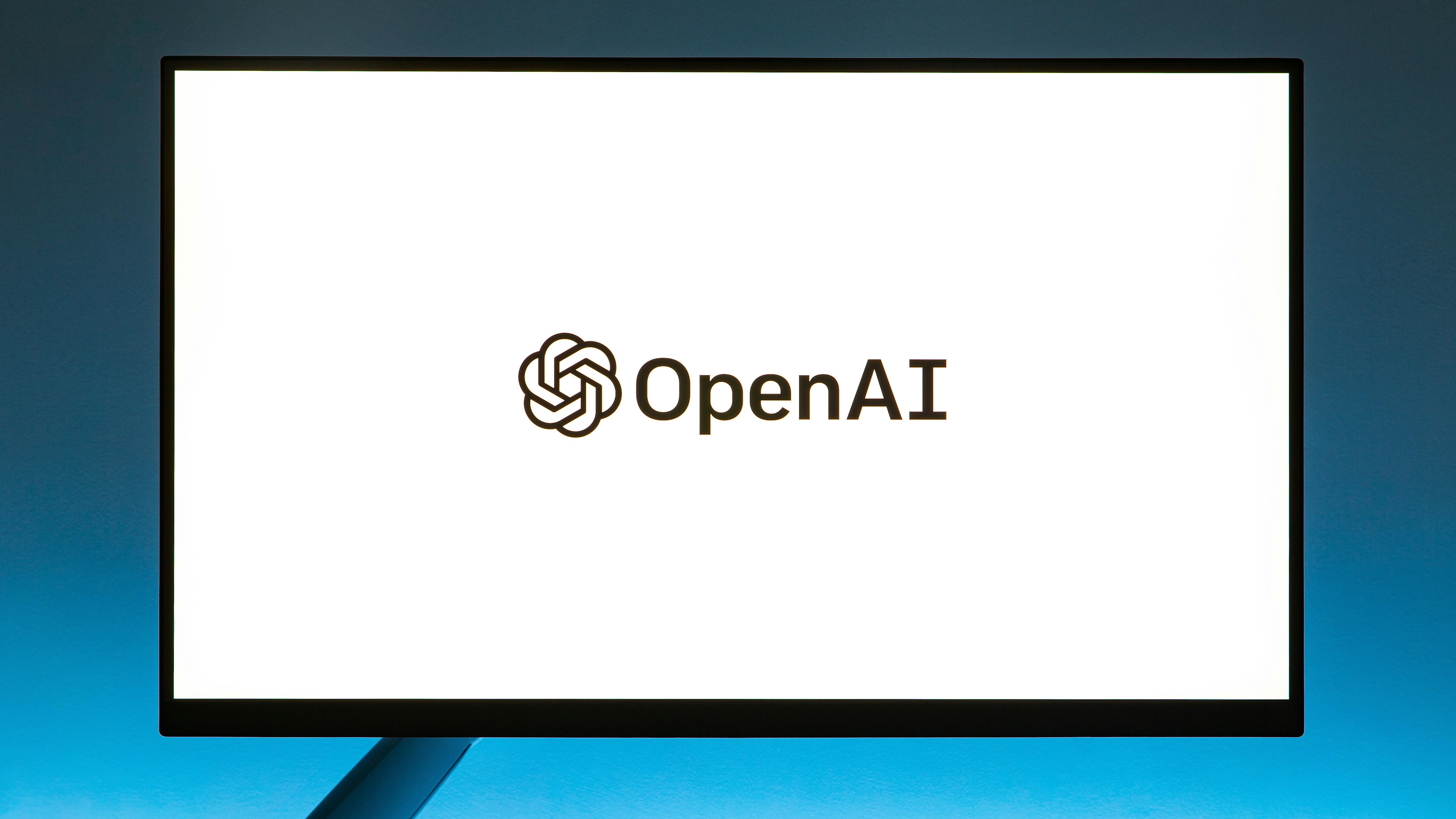 Professionals discussing in an office, Can AI Help Leaders Build Better Teams