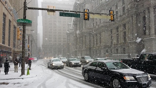 Emergency responders manage storm aftermath in Pennsylvania road.