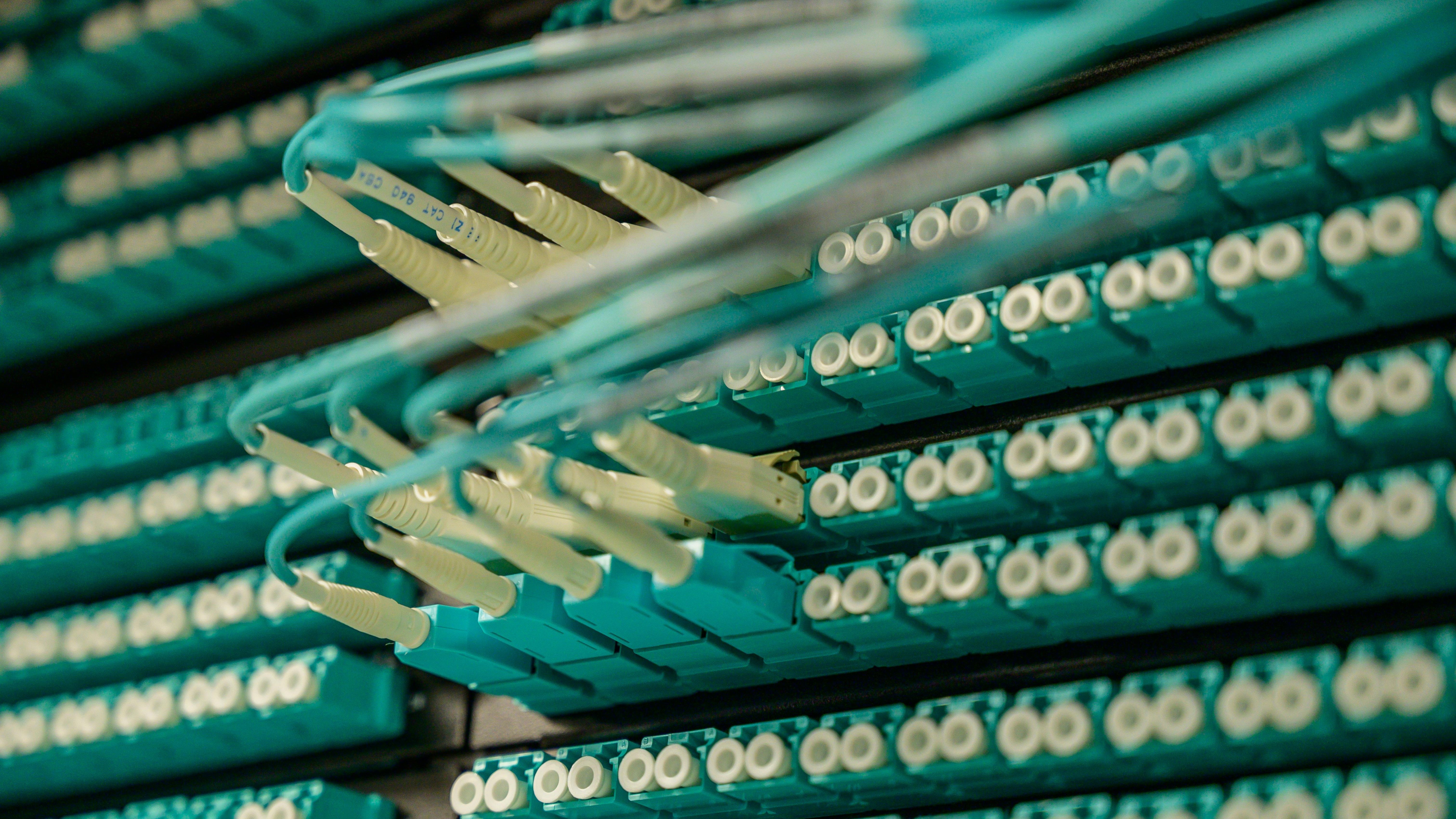 Professional man seated discussing AI Network Operations with Cisco branding.