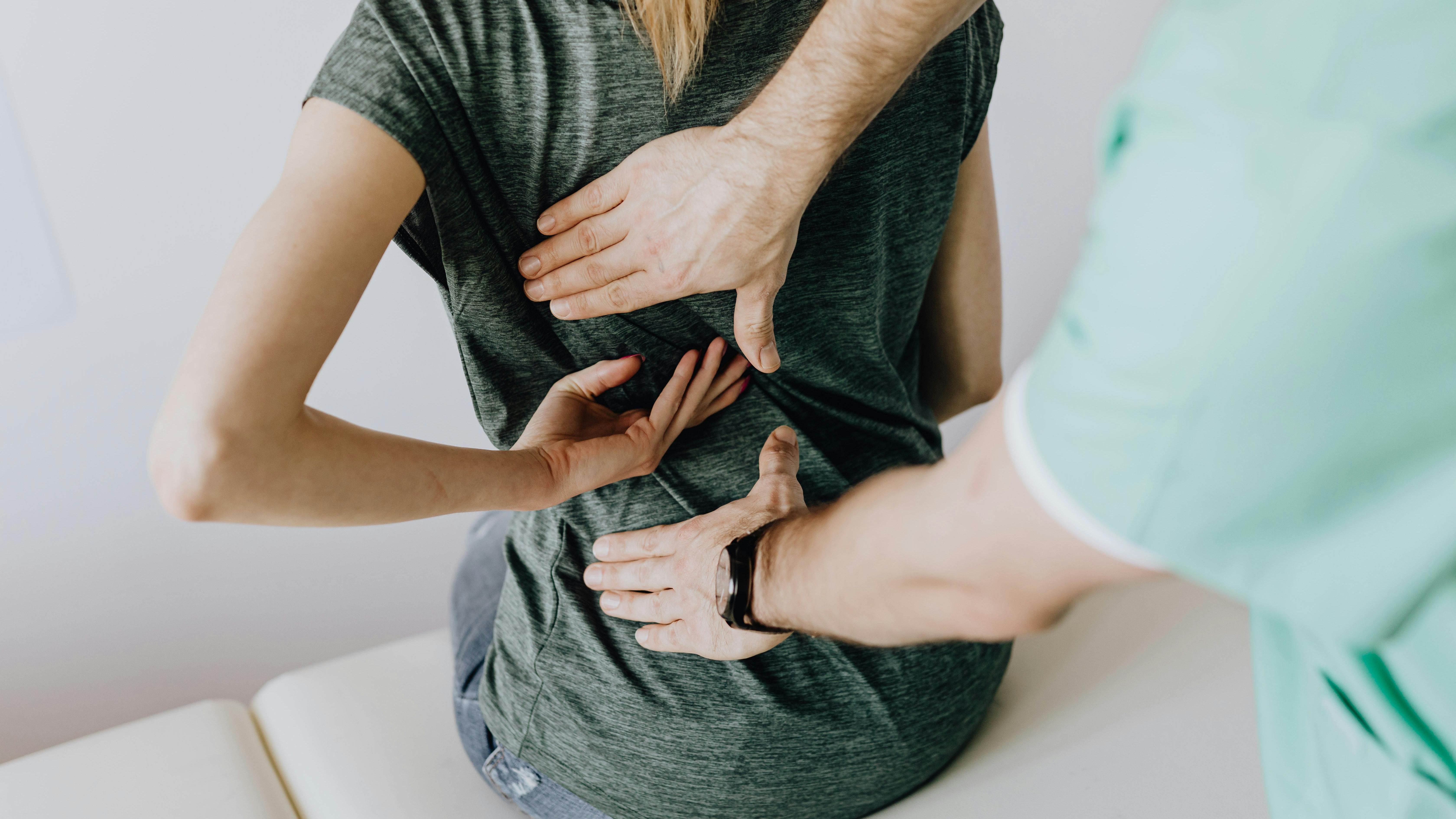 Nurse attending to a patient in a hospital room, highlighting health benefit cost increases.