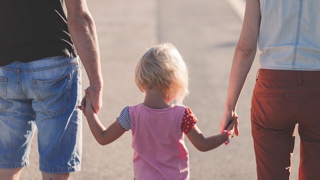 Mother and child hugging at school, managing separation anxiety.