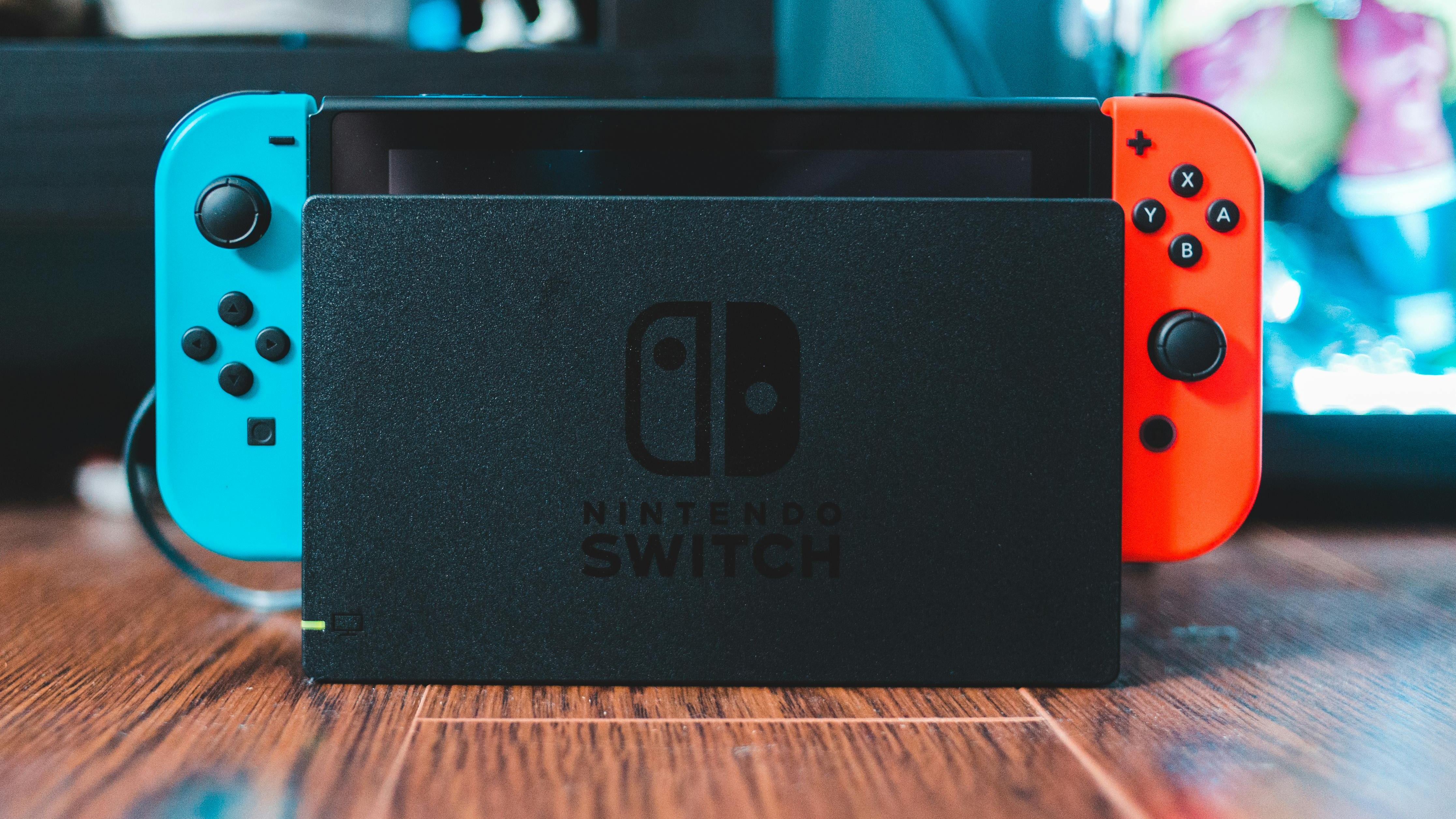Nintendo Switch showing Dave The Diver characters for free Switch 2 upgrade.