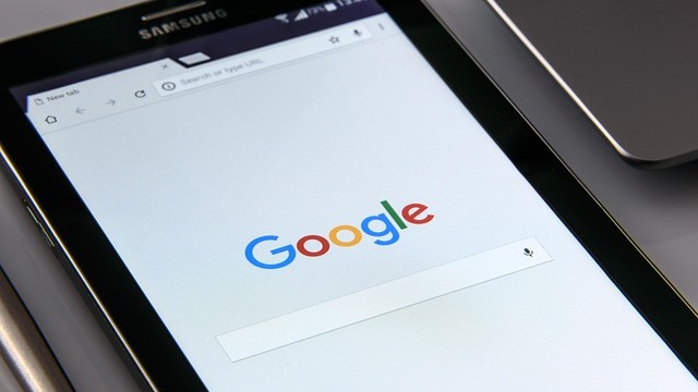 Google Fiber logo displayed on a smartphone, representing technology.