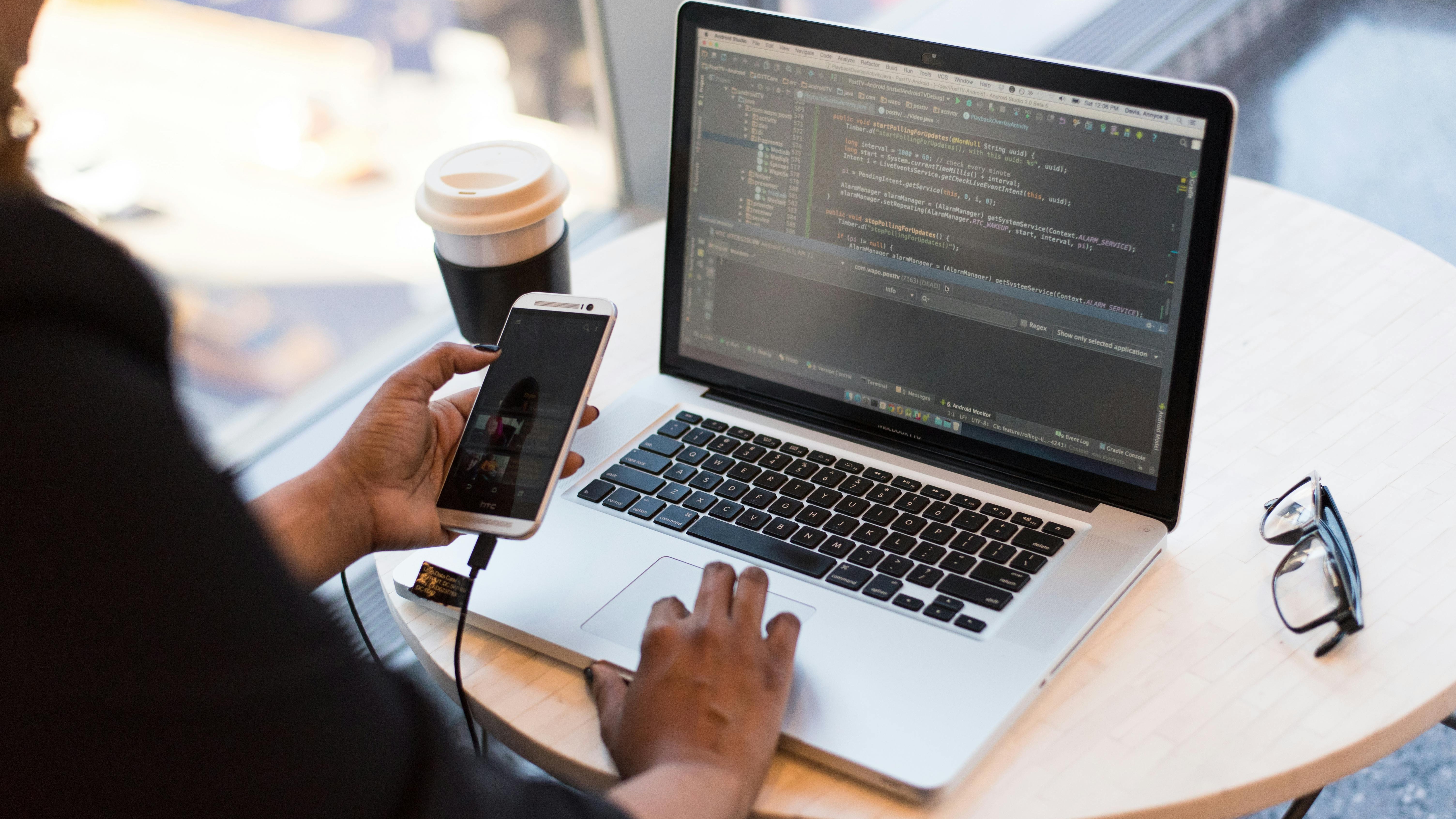 Close-up of coding on laptop, software engineering jobs in AI era.