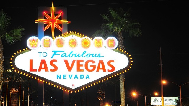 Las Vegas Strip at night with colorful casino lights.