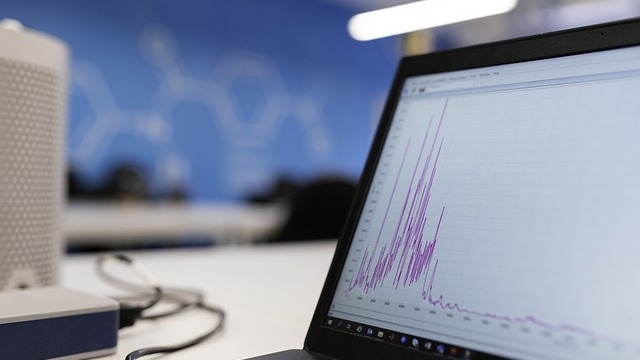 AI in the workplace concept with illuminated 'think' in gradient background.