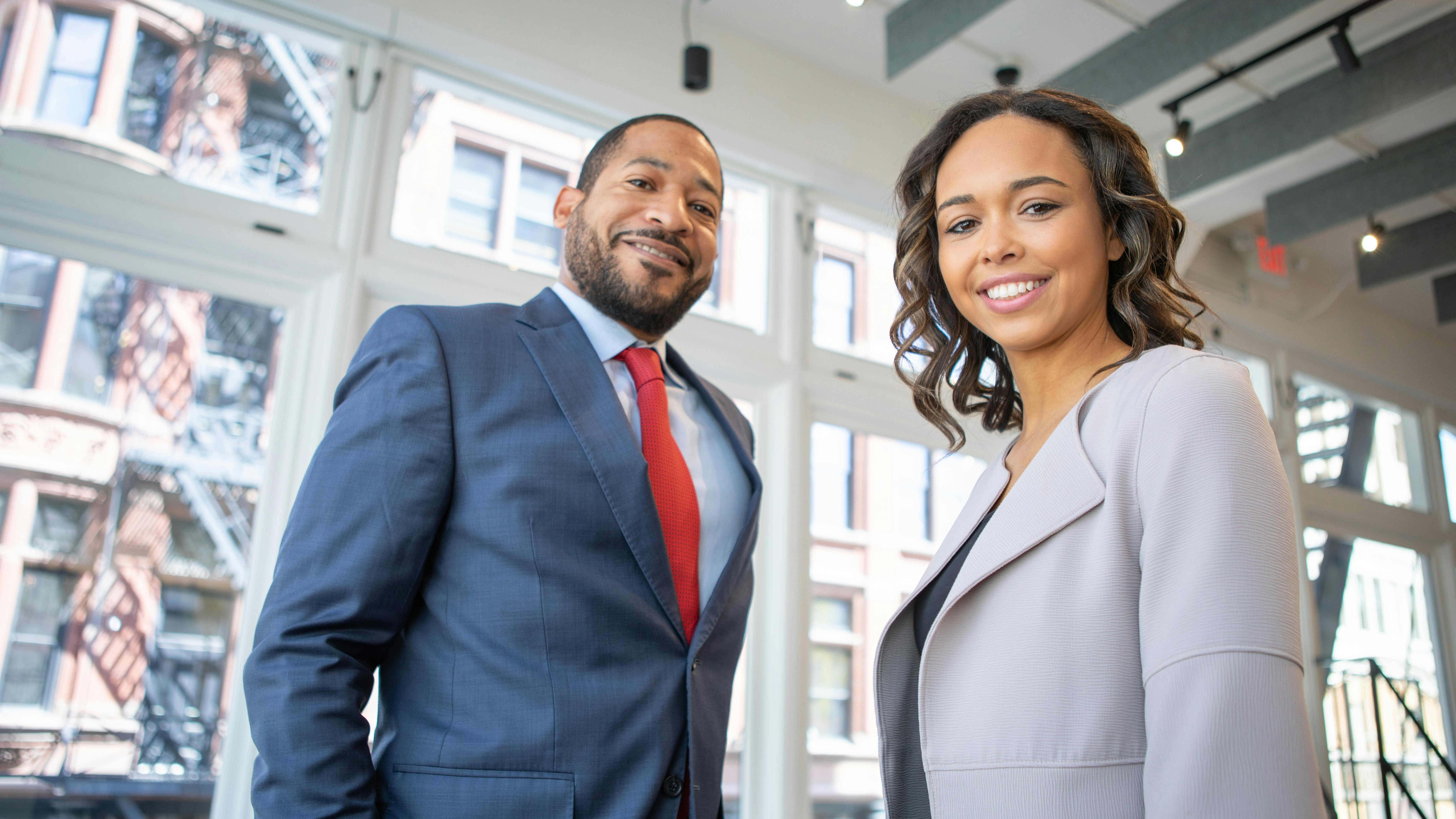 Job seekers at fair discussing equal pay developments