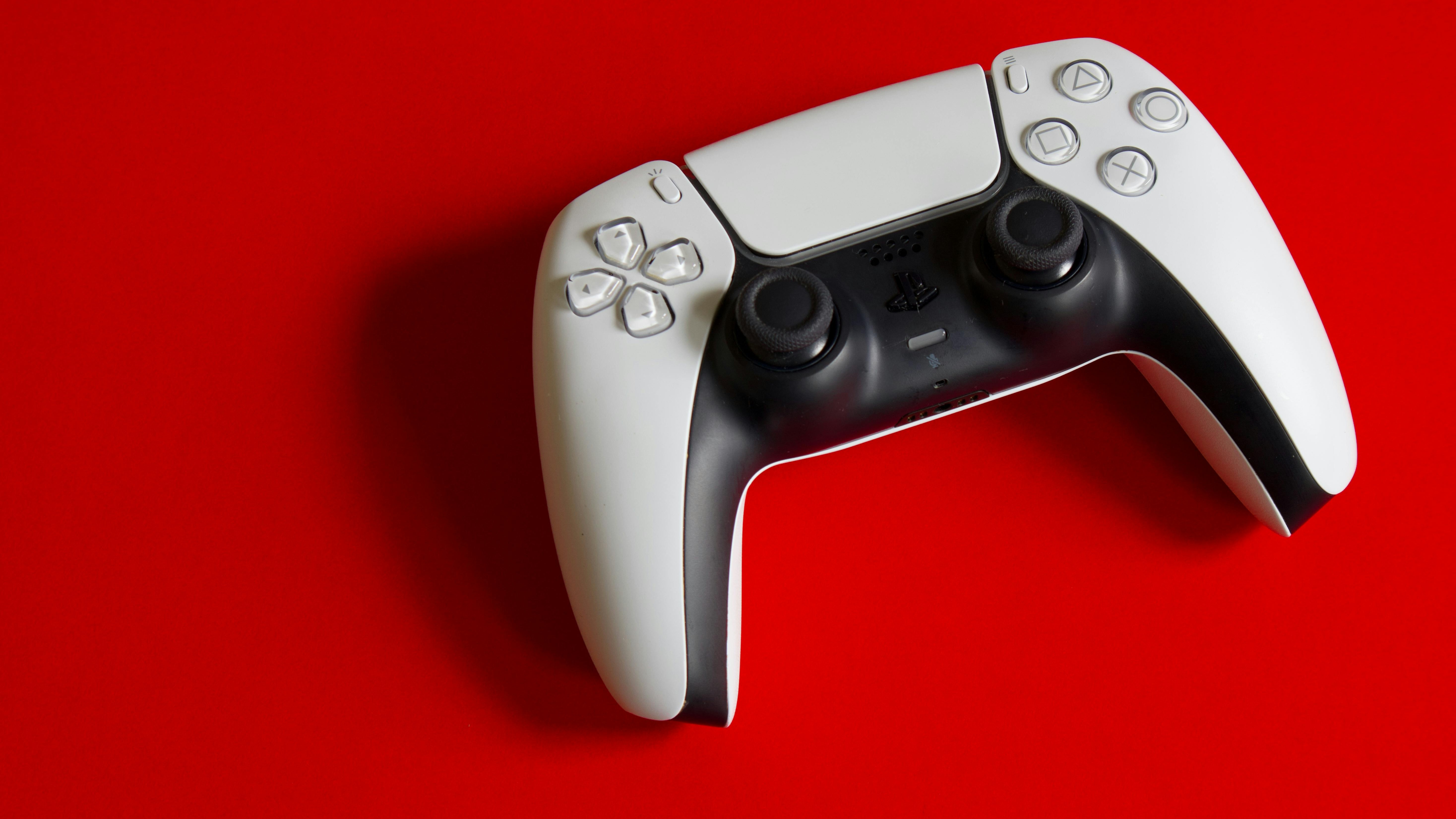 PS5 console and controller alongside GTA 6 characters, cinematic split image.