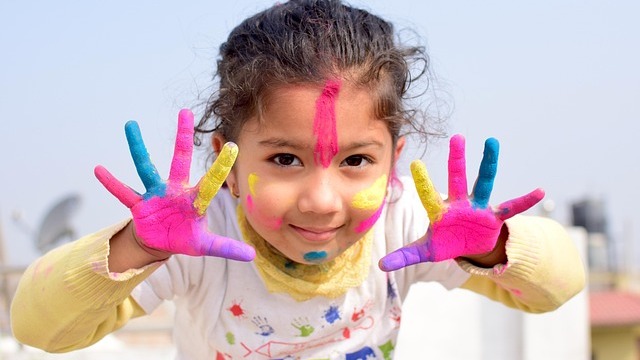 Child engaging in easy bubble painting craft for kids outdoors