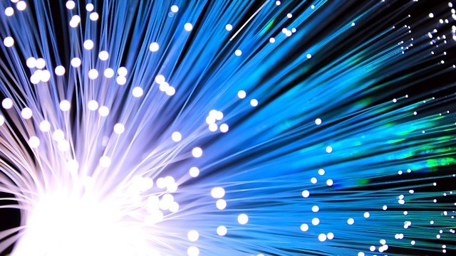 Conceptual art of fiber internet access costs, featuring colorful design.
