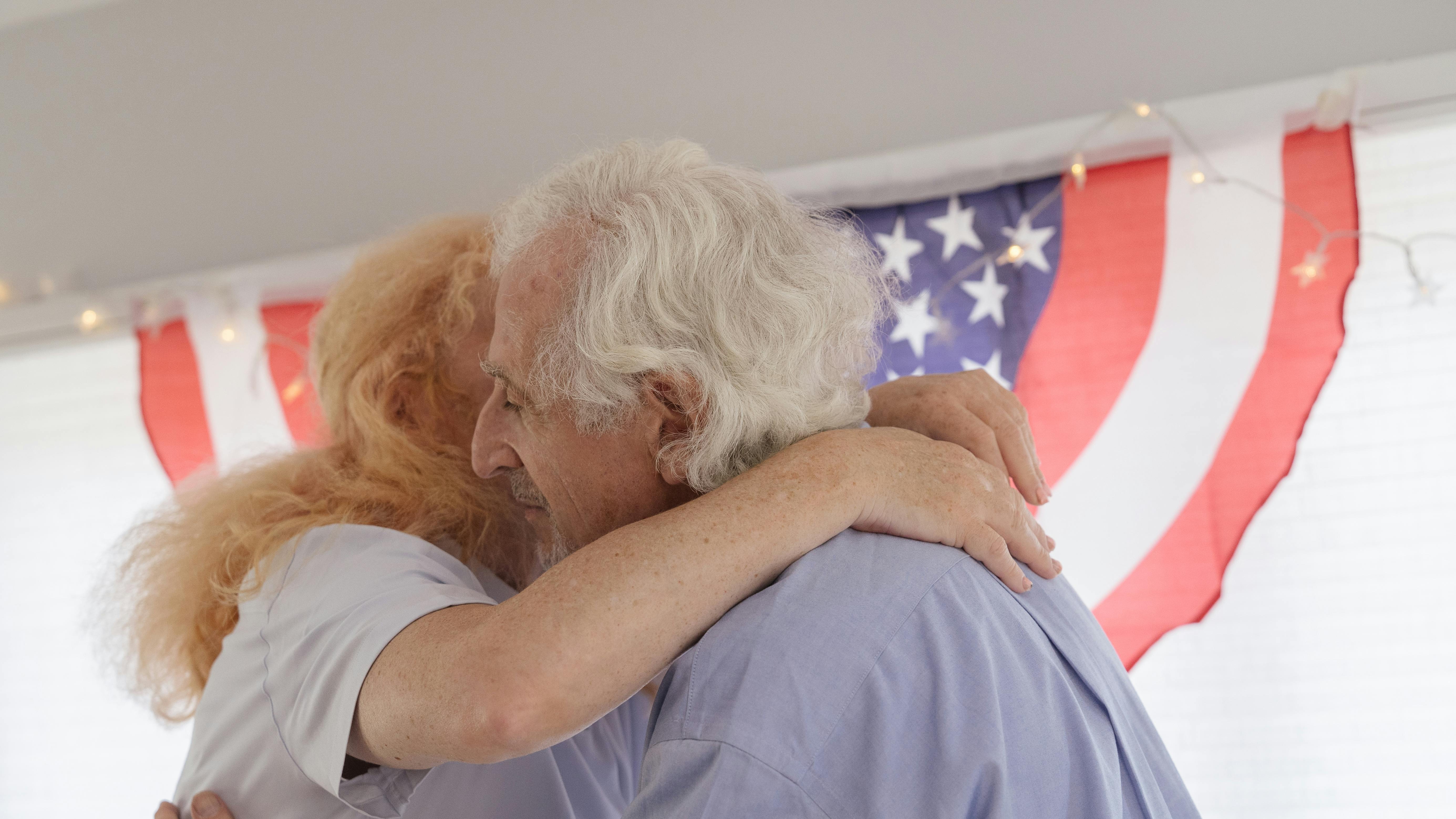 Delta Veterans Celebration with elderly veterans showing respect.