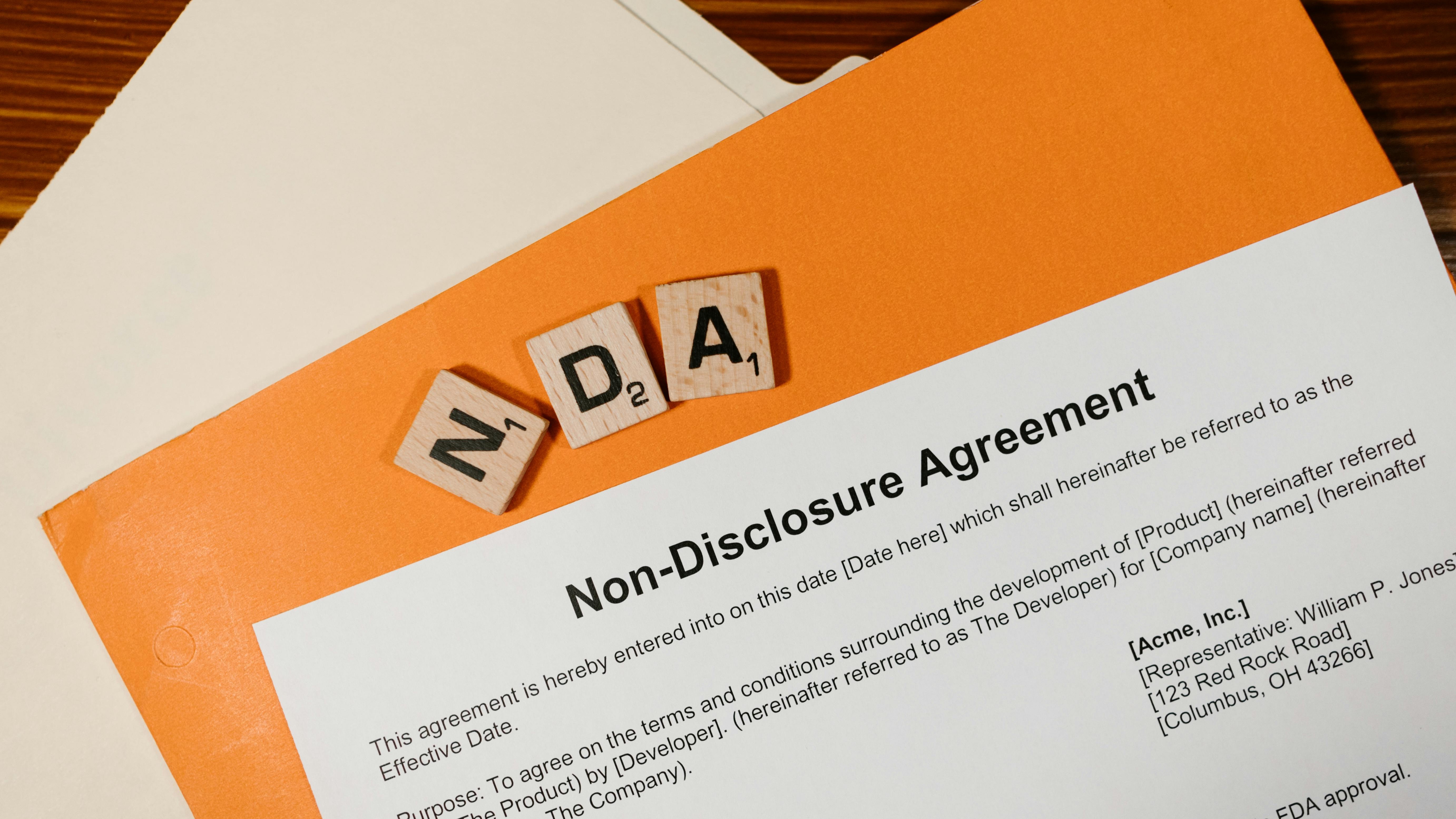 Banning NDAs impact on HR: Woman being silenced in office.