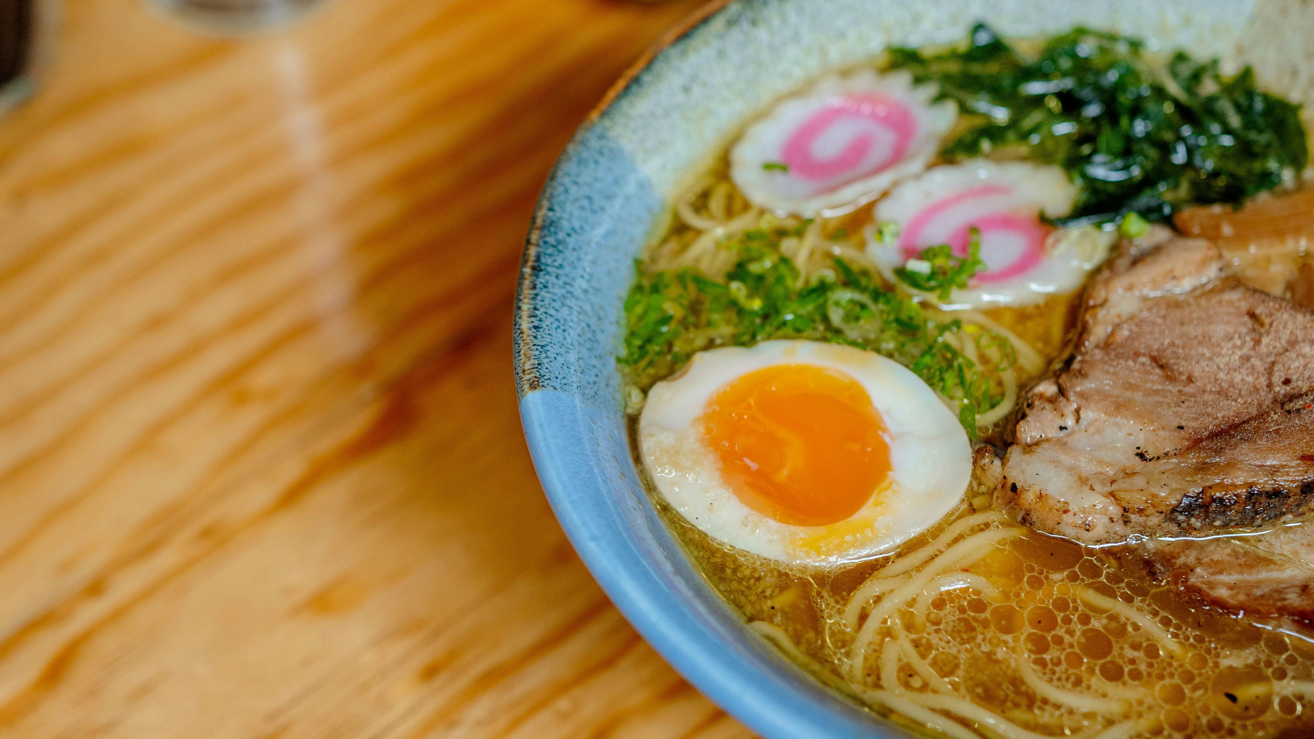 Diverse ramen bowls in San Antonio restaurant kitchen.