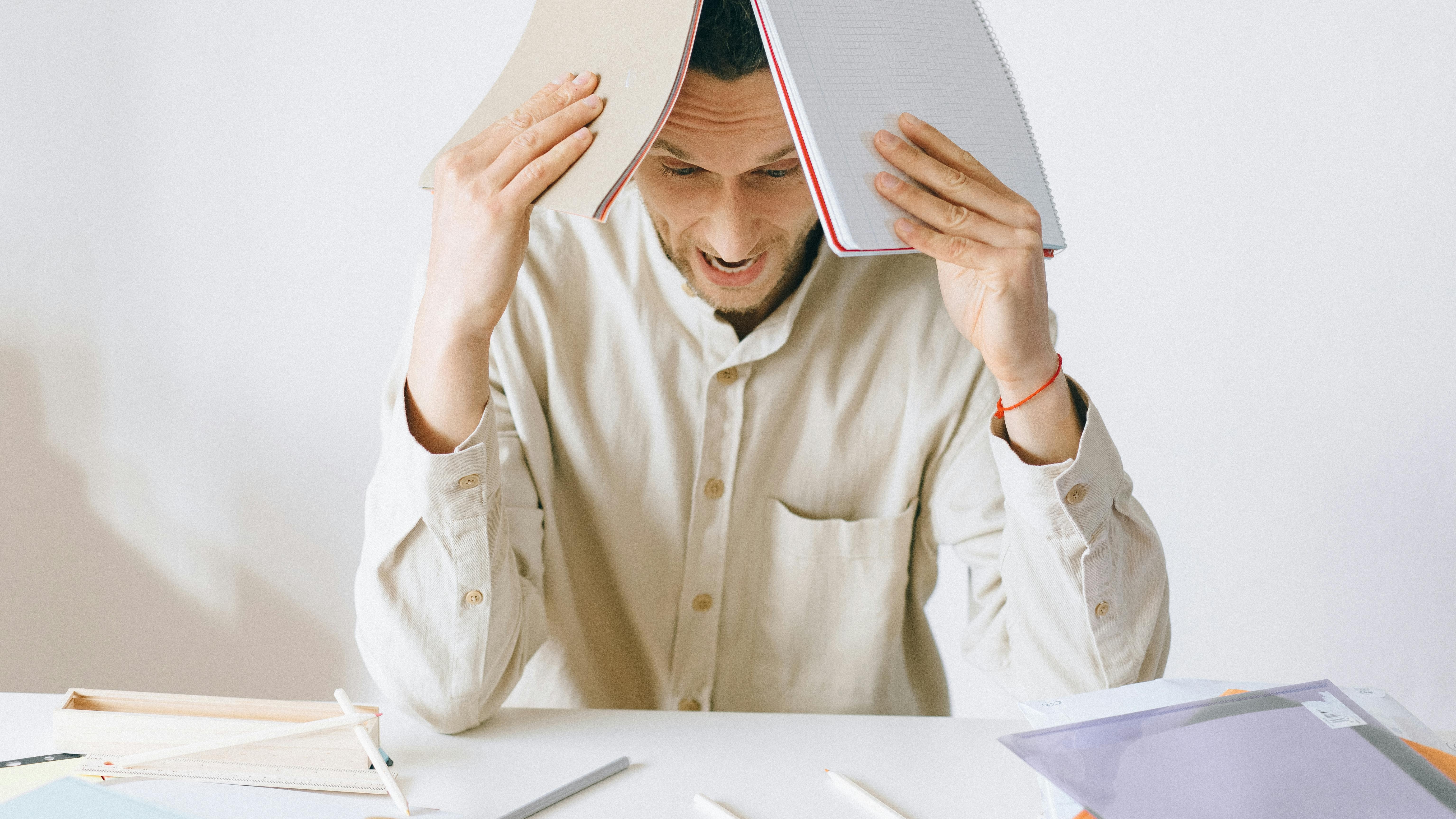 Stressed employee in office highlighting burnout trends.