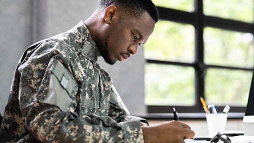 Determined soldiers finish military competition, embodying perseverance