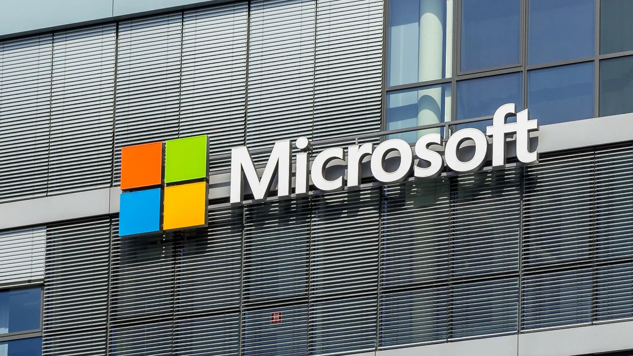 Microsoft logo on building, symbolizing technology update.