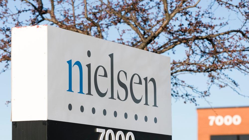 Group of women at Nielsen BRG Inclusion Campaign smiling in office.