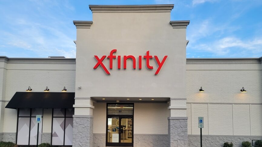 Colorful smartphone displaying Xfinity logo.