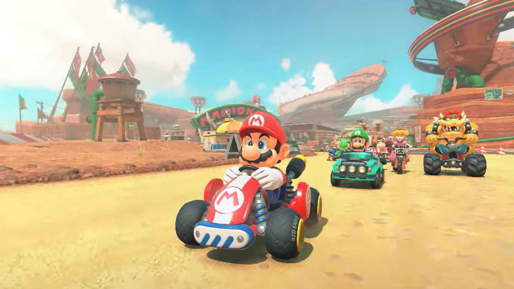 Mario Kart World Reviews: Mario stunt in vivid canyon track.