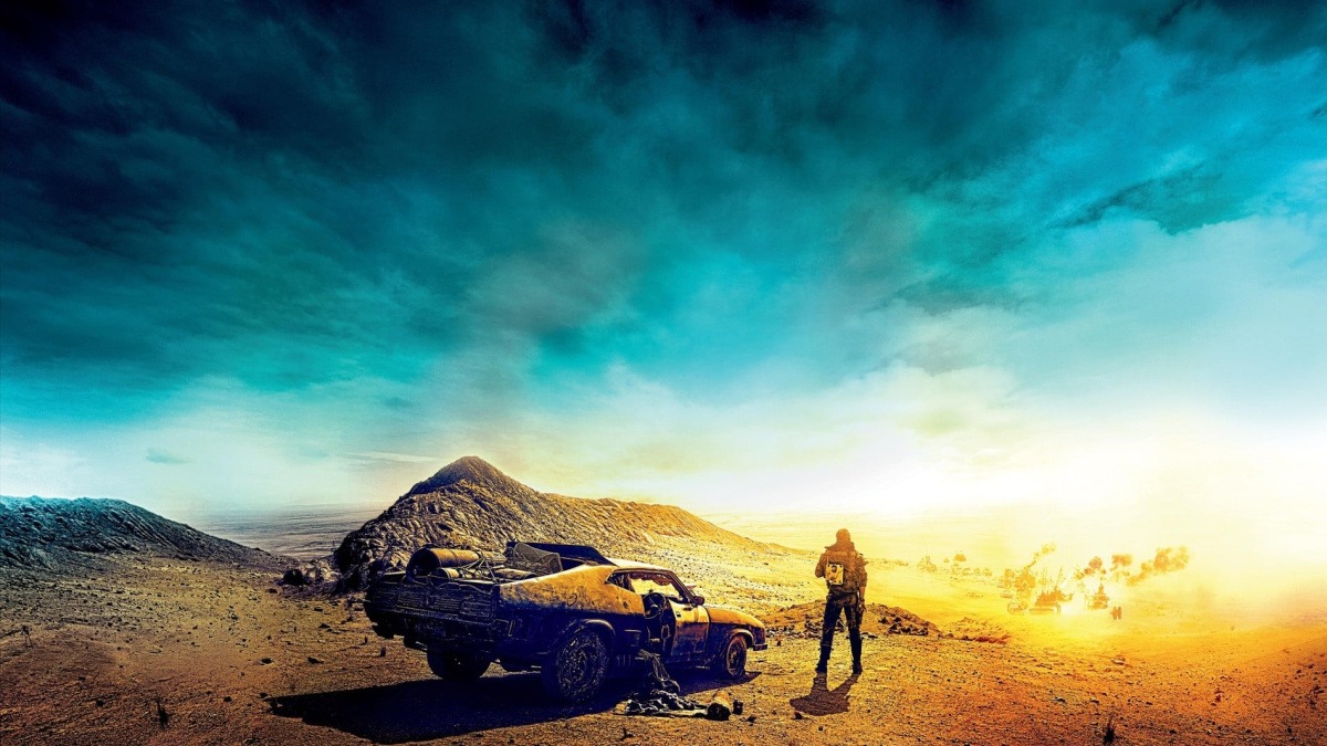 Futuristic convoy in desert illustrating military logistics lessons from Mad Max.
