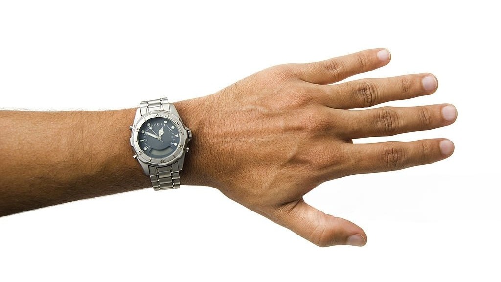 Military personnel wearing affordable military watches amid tactical gear.