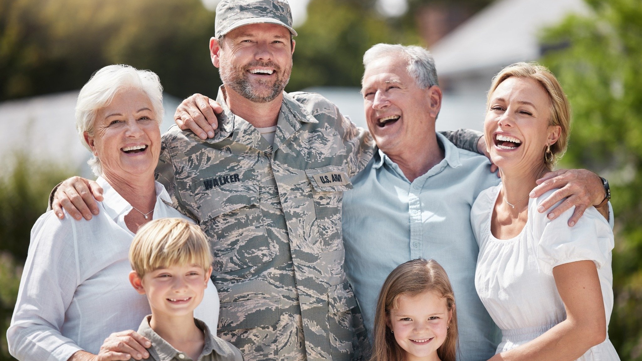 Large group holding donation checks for veteran services San Antonio.