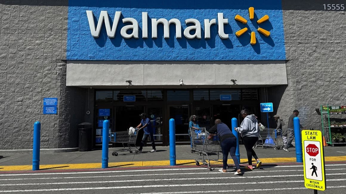 Front view of a Walmart store facade highlighting the logo.